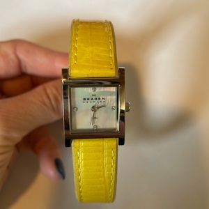 Skagen watch with yellow leather band and mother of pearl face with rhinestones